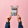 bag of chips on pink background